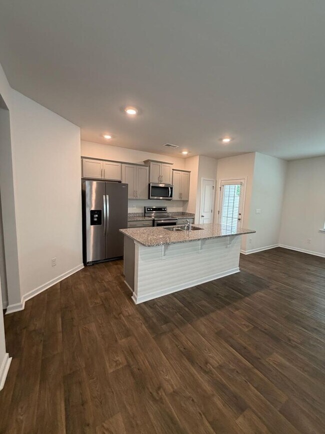 Building Photo - Brand new 3 bedroom townhome available for immediate move in!