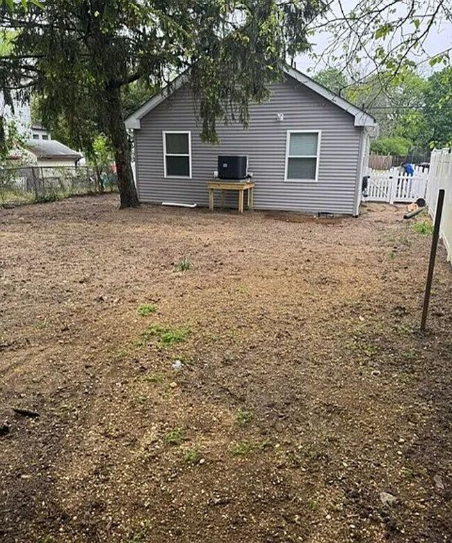 Building Photo - NEWLY REBUILT ONE LEVEL LIVING SPACE