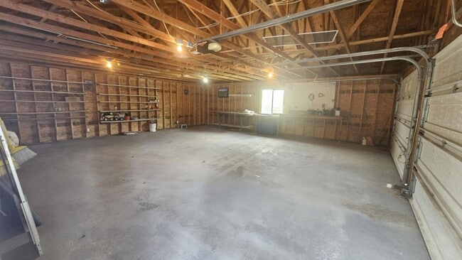 Building Photo - Out of town house with double garage and l...