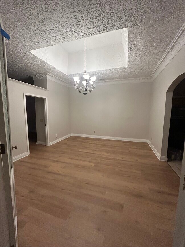 Den/living rm you enter at top of front stairs. Kitchen to rt front bedroom/library left - 426 N Roane St