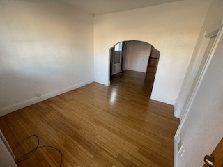 archway separates front living room and dining room - 1615 Hooker St