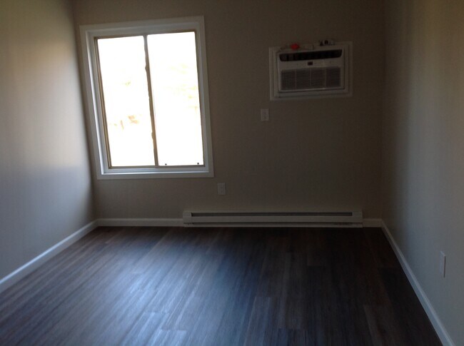 Guest room with new A/C wall unit - 103 Amberly Dr