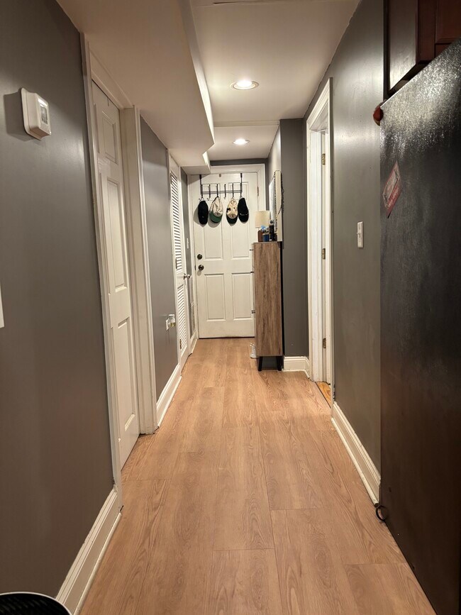 Hallway leads to bathroom on the right, bedroom on the left, - 4871 N Magnolia Ave