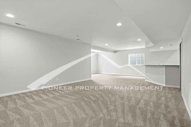 Building Photo - Elegant Ranch-Style Home with Main Floor Primary Bedroom with 3-Car Garage and Finished Basement ...