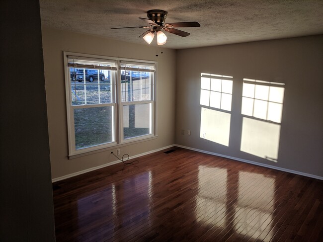 Living room with beautiful original hardwood floors - 15 Kirby Pl