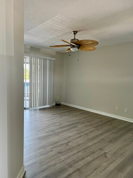 New flooring open & bright Living area. - 7006 Midnight Pass Rd