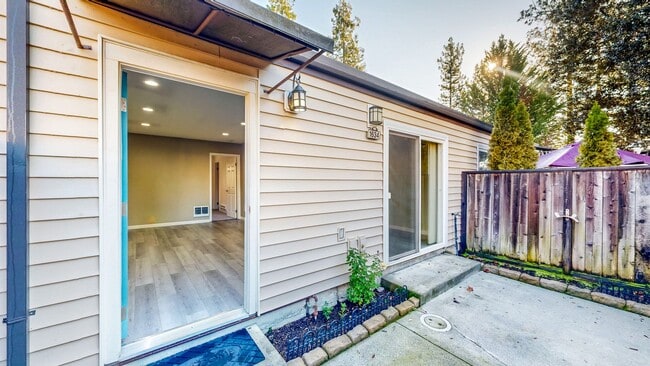 Building Photo - Cozy 1 bedroom 1 bath end unit condo with 1 car garage and private patio located next to Peterson...