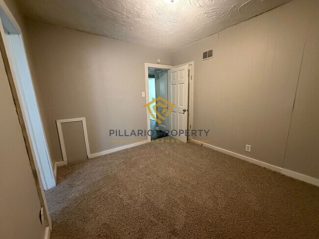 Building Photo - Charming 3-Bedroom Stone Bungalow with 2-Car Detached Garage & Fenced Yard, Available NOW!