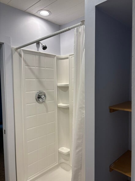Shower with edge of bathroom storage on right - 3837 Old Hendersonville Highway