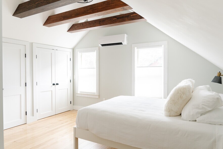 Primary bedroom with vaulted ceiling, double closets, and mini split (AC and additional heat option) - 80 Maple St