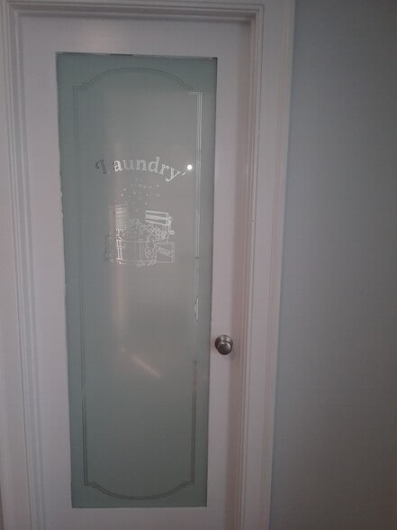 Separate laundry room and utility room with private entrance (great way to keep muddy shoes from spreading throughout the house) - 701 Rosalyn Dr