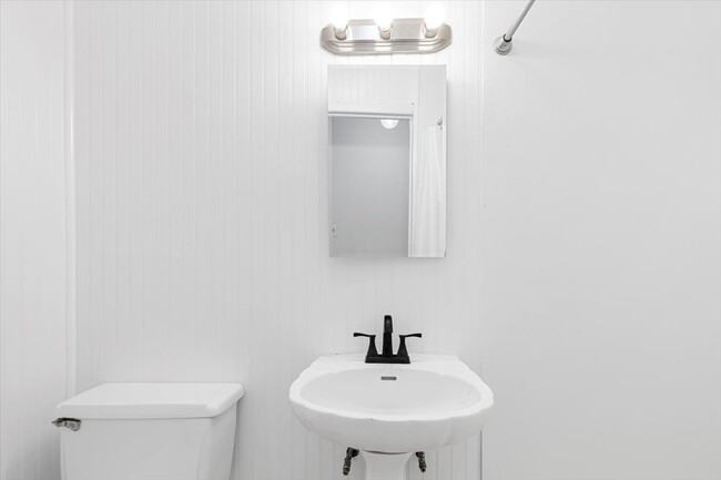 Cozy full hall bathroom with a stand-in shower. - 45 High St