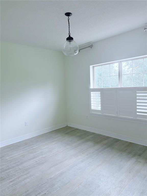 Building Photo - 7112 Enchanted Lake Dr