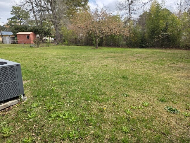 Building Photo - 4 Bedroom, 1.5 bath, 1 car garage, fenced in yard, under 25 dog may be permitted