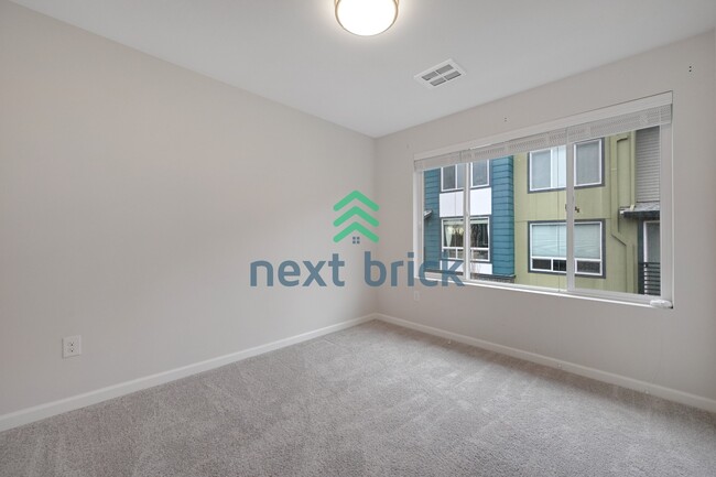 Building Photo - A Beautiful Corner Home Designed for Comfort, Light & Community!