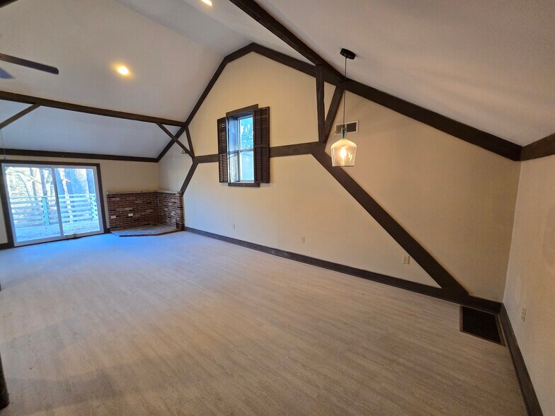 Bright open floor plan with dramatic beam details. - 60 W Winter St