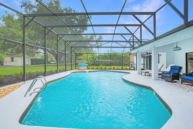 Building Photo - Beautifully Updated 3/2 Pool Home with Large Backyard in Lake Ajay (Gated Community)