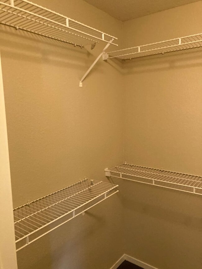 Building Photo - Gated community just minutes south of the strip, 2br/2bath, 2nd floor condo.