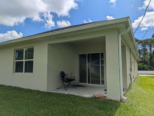 Building Photo - Modern 4-Bedroom Home with Large Backyard in Quiet SW Palm Bay – Available Mid-June