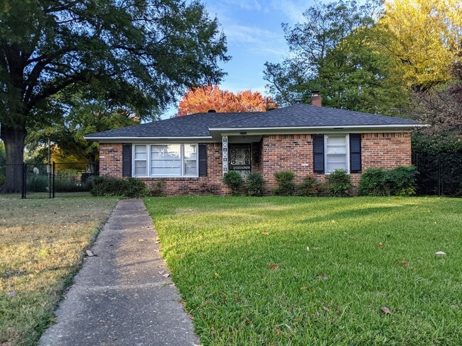 Building Photo - Brick Ranch Charmer with Hardwoods, In-Unit Laundry & Fenced Yard — Available Now!