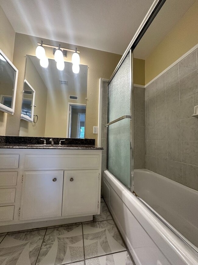 Building Photo - UPSTAIRS 1 BEDROOM CONDO FOR LEASE- GATED ...