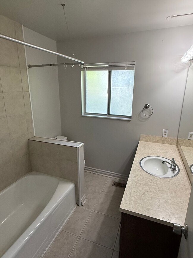 Building Photo - Beautiful town home with deep 2 car garage and a large covered patio