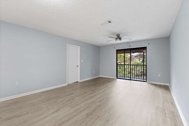 Building Photo - Freshly Updated 2BR Condo with Private Balcony, Community Pool, & In-Unit Laundry