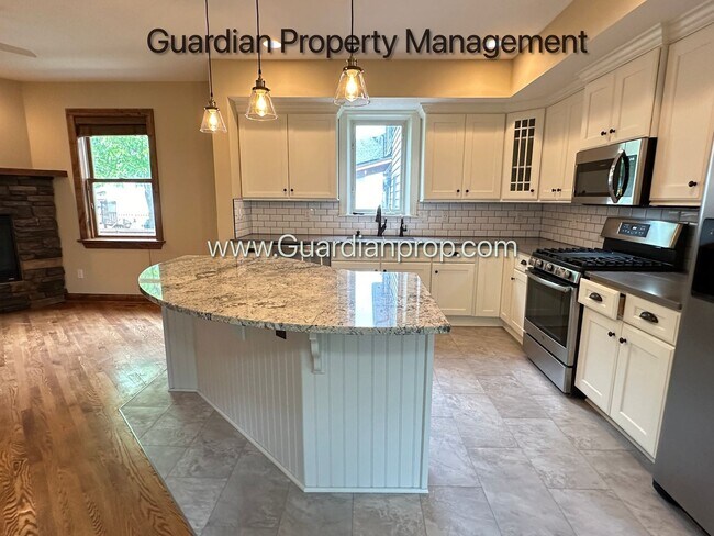 Building Photo - Downtown Hopkins SFH, Fenced Yard, Patio, Spacious Primary, 4 Car Detached Garage