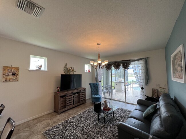 Building Photo - "Spacious 4-Bedroom Lutz Home with Elegant...