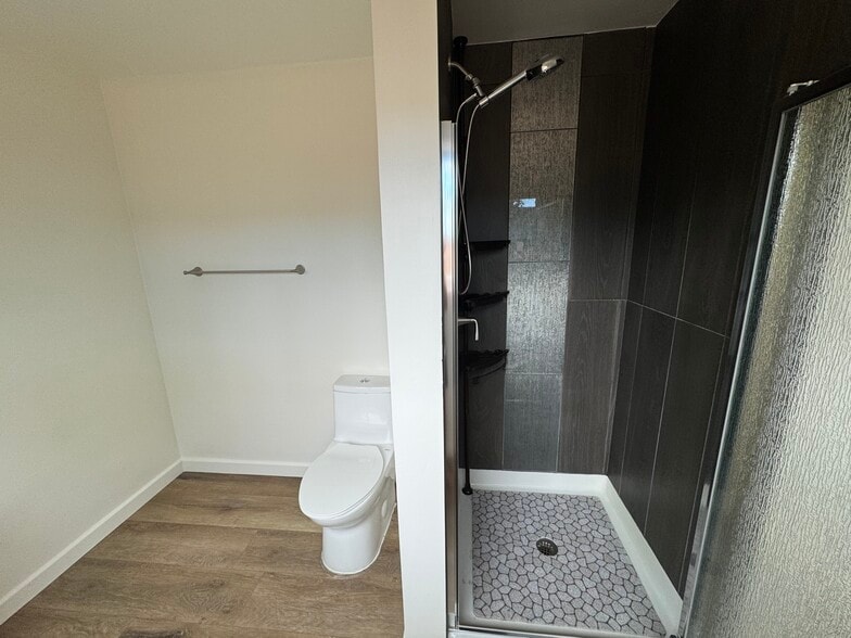 Shower and toliet in apartment - 11305 Sheldon St
