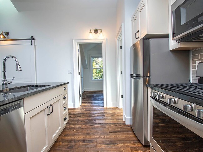 Building Photo - Expansive Loft-Style Carriage House in Private Haller Lake Estate