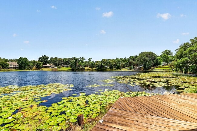 Building Photo - Available Now! Waterfront Living at Its Best – Pool, Decks & Gated Privacy