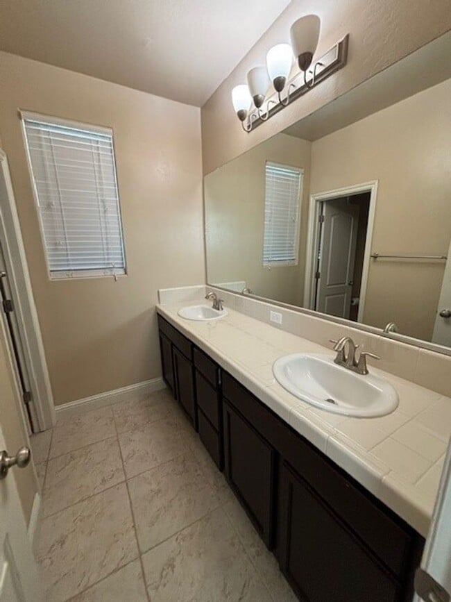Building Photo - Move-In Ready: Elegant 4-Bedroom Home with Paid Solar in Gated Community