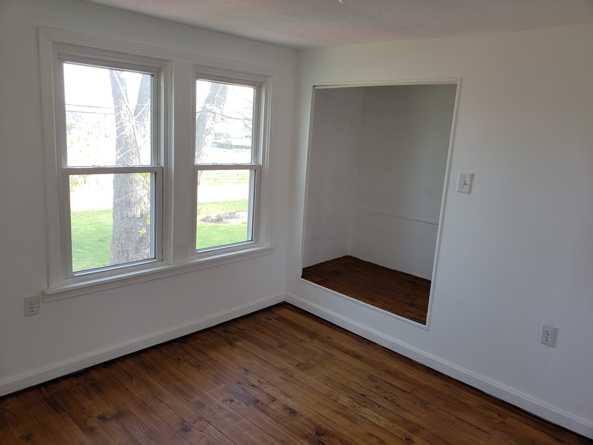Second floor bedroom at front of house has three windows and an area that can be used as a closet or - 10106 Wingfield Rd