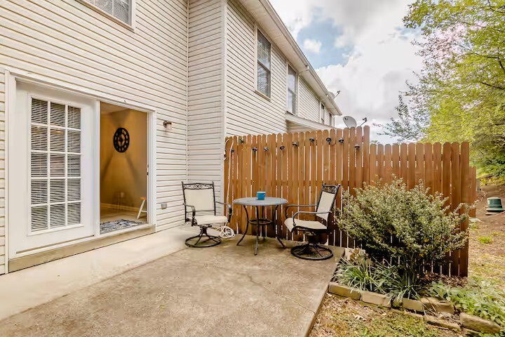 Patio out back with landscaping. Minimal grass but ample for pets as needed. - 515 School Ln