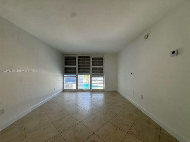 Building Photo - 10275 Collins Ave
