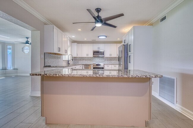 Building Photo - Treasure Island Three Bedroom, Two Bath Furnished Single Family Home on the water.