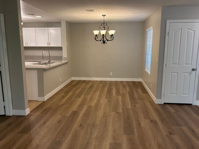 Building Photo - Condo 3 bedrooms 2 bathrooms 1 car garage gated subdivision.