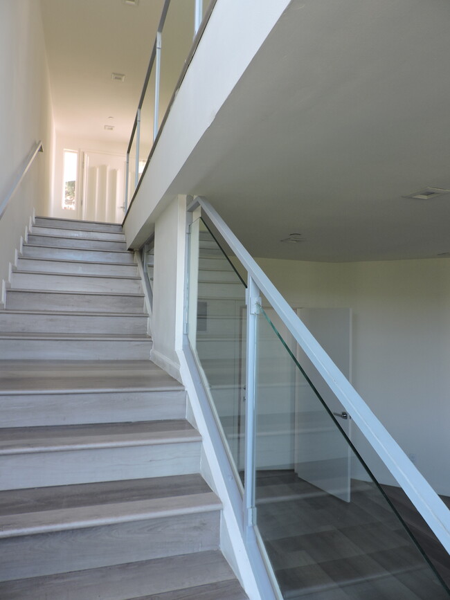 STAIRS FROM ENTRY TO MIDDLE LEVEL - 5220 Medina Rd