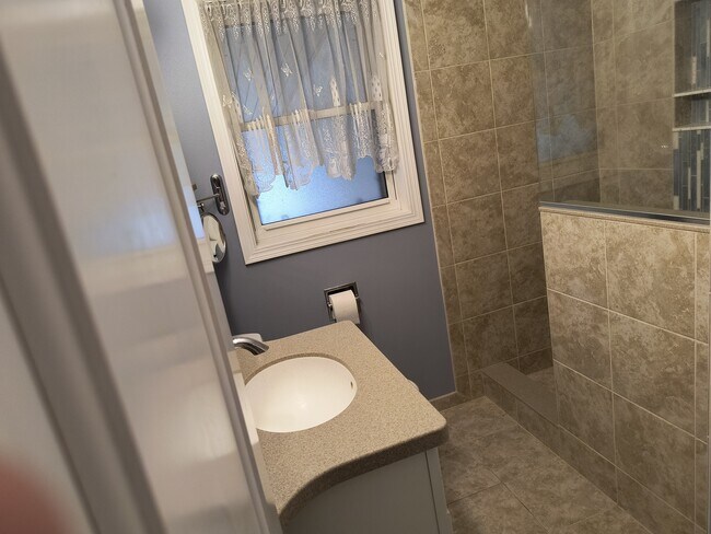 Newly remodeled bathroom with walk in shower. - 2227 23rd St S
