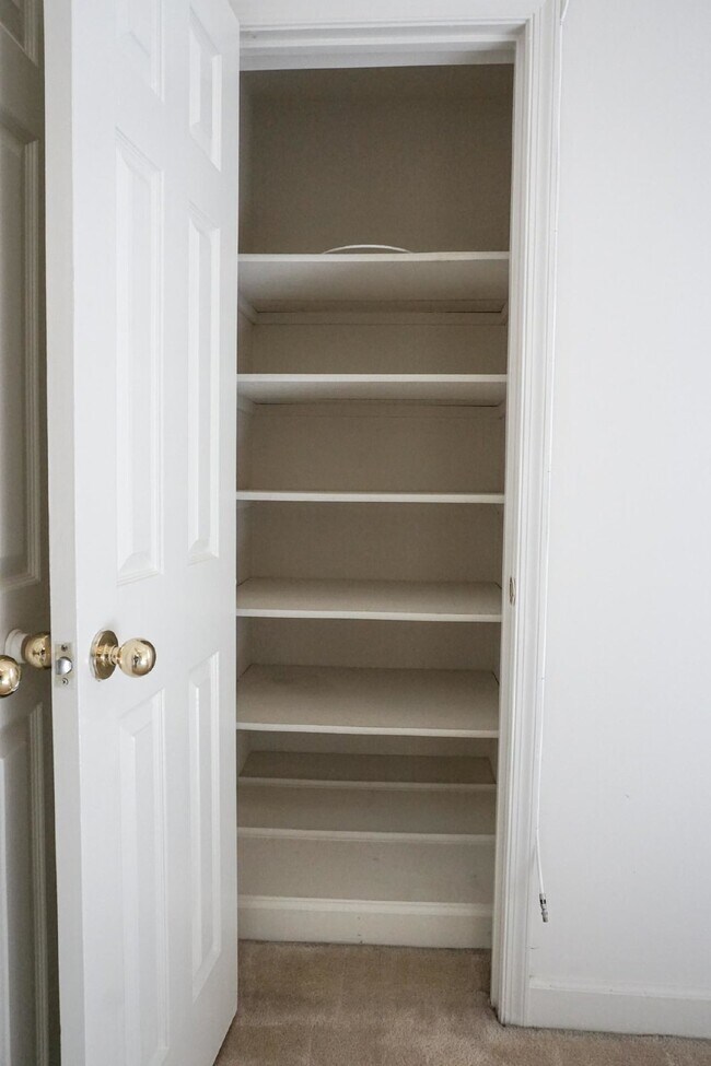 Building Photo - Beautiful brick townhome featuring three f...