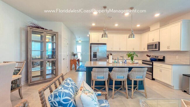 Building Photo - EXCEPTIONAL AND SPACIOUS FURNISHED TOWNHOME WITHIN WATERSIDE- NAUTIQUE!