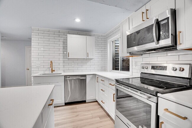 Building Photo - $3,295.95 - 3 bed, 2 bath updated Home in Littleton with Two Full Kitchens and Impressive Yard!