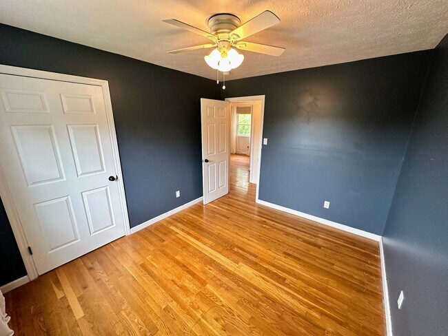 Building Photo - AVAILABLE NOW! Spacious 4 BR, 2 Bath House! Wood Floors, Attached Garage, W/D Included