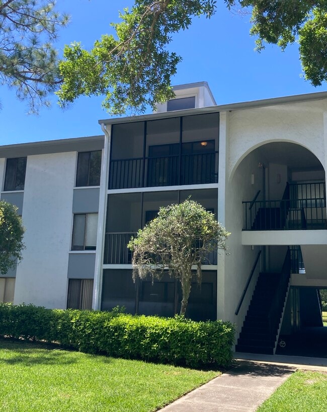 Peaceful 3rd floor location across from a preserve; pond visible from breezeway! - 1353 Pine Ridge Cir E