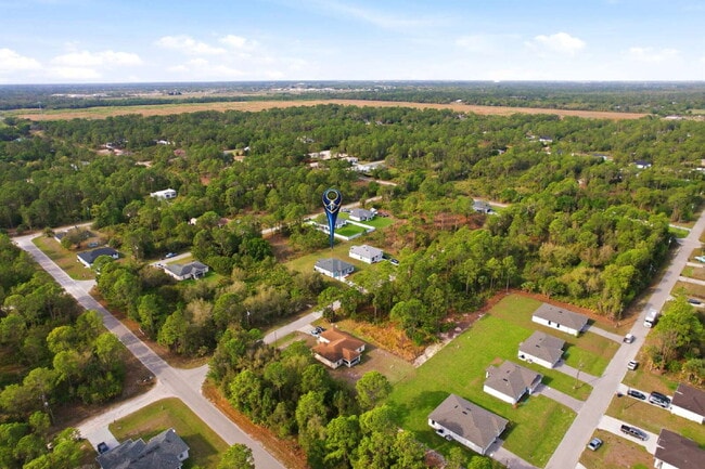 Building Photo - Brand New 4-Bedroom Gem with 2 Full Baths on Large Lot in Lehigh Acres – A Perfect Family Haven!