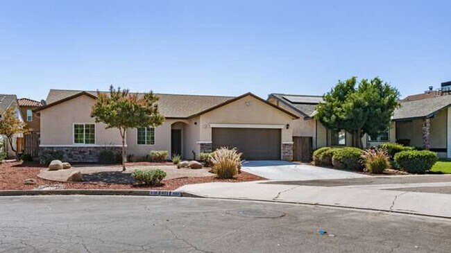 Building Photo - Four bedroom/2-bath home with 2-car garage