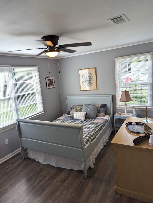 Bedroom 2 is warm and cozy. Queen bed, original art and a closet. - 4107 Crane St