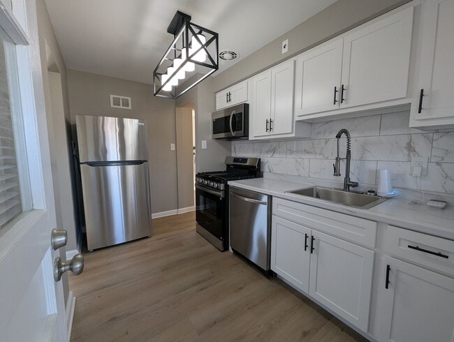 Building Photo - Fully Renovated Home with Sunroom, Garage & Huge Fenced Yard