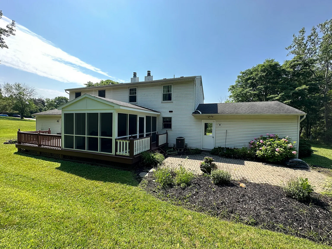 Back yard with sunroom - 23 Roxwell Ct